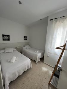 Postel nebo postele na pokoji v ubytování Apartamentos Ortega