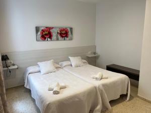 Postel nebo postele na pokoji v ubytování Apartamentos Ortega