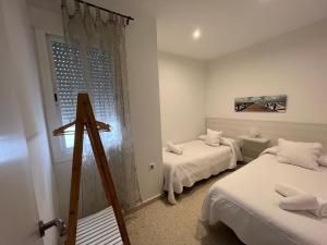 Postel nebo postele na pokoji v ubytování Apartamentos Ortega