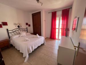 Postel nebo postele na pokoji v ubytování Apartamentos Ortega