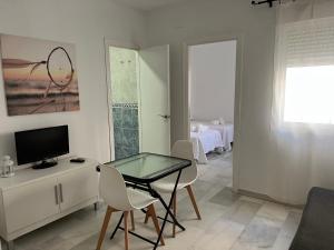 TV a/nebo společenská místnost v ubytování Apartamentos Ortega