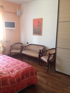 A bed or beds in a room at Maison d'Elite