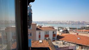 a view of a city from a window at Musk24H in Istanbul