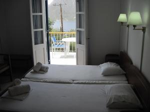 Postel nebo postele na pokoji v ubytování Tatsis Apartments