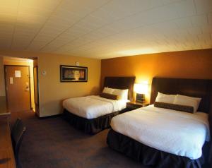 Cama o camas de una habitación en Evergreen Resort
