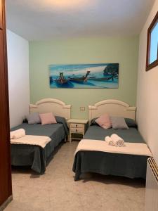 Postel nebo postele na pokoji v ubytování Apartamento Chamela
