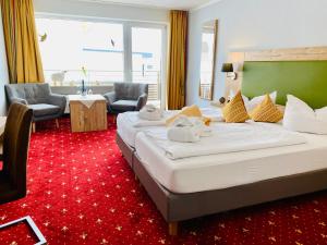 Postel nebo postele na pokoji v ubytování Hotel Nesselwanger Hof