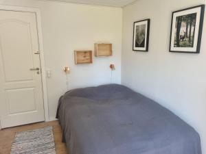 Un pat sau paturi într-o cameră la Elling Bed & Breakfast