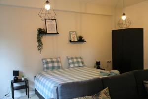Postel nebo postele na pokoji v ubytování Bonsai Apartment I