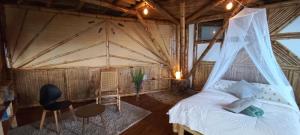 Postel nebo postele na pokoji v ubytování Ecohotel Soplo del Tambo