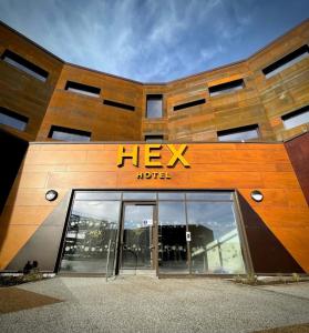 a hex hotel sign on the side of a building at Hex Wildlife Hotel at Yorkshire Wildlife Park in Doncaster