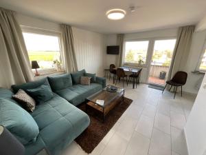 Posezení v ubytování Ferienwohnung in Dornumersiel an der Nordsee