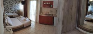 A bed or beds in a room at VARBENIS STUDIOS