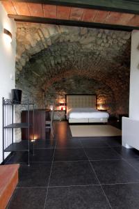 Postel nebo postele na pokoji v ubytování Hotel Corte Santa Libera + 37 fotografií