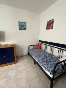 Giường trong phòng chung tại Vittoria Paradise it Castelsardo Sardegna