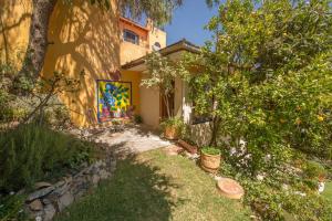 a house with a painting on the side of it at Casa Estrella de la Valenciana Hotel Boutique in Guanajuato