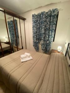 Postel nebo postele na pokoji v ubytování BELLA ASSISI B & B