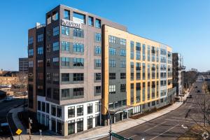 an apartment building on a city street at Luxury Apartments by Hyatus at Pierpont in New Haven