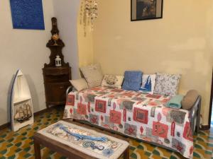 a bedroom with a bed and a table at Affittacamere l'Acciuga in La Spezia