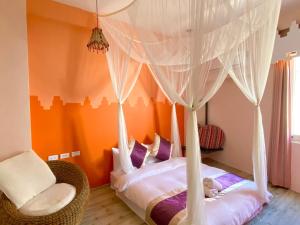 Katil atau katil-katil dalam bilik di Hana B&B
