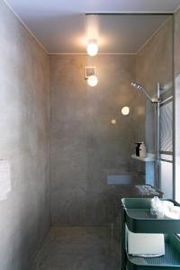 a bathroom with a shower and a sink at Bonjour Maison -Self check-in in Fukuoka