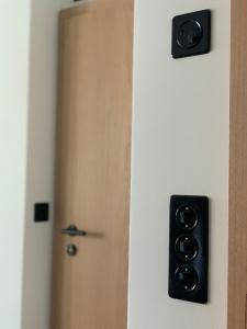 a door with a black door knob and a door with a door at Triftbach - View over Zermatt in Zermatt