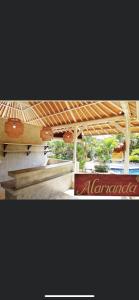 a picture of a building with a sign on it at Alamanda Bingin in Uluwatu +27 photos
