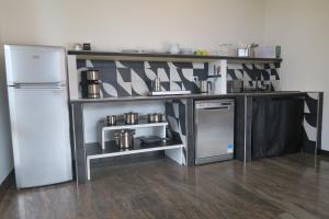 Kuchyň nebo kuchyňský kout v ubytování Villa Arianna - Suite Arianna