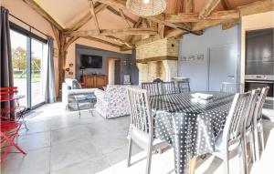 a kitchen and dining room with a table and chairs at Stunning Home In Hattenville With Wifi in Hattenville