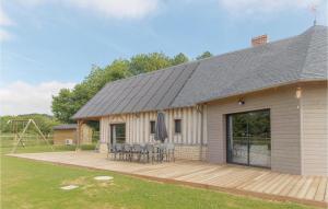 a house with a wooden deck with a playground at Stunning Home In Hattenville With Wifi in Hattenville