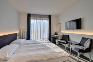 Postelja oz. postelje v sobi nastanitve Hotel Luna Garni