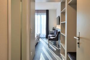 Predel za sedenje v nastanitvi Hotel Luna Garni