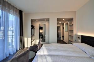 Postelja oz. postelje v sobi nastanitve Hotel Luna Garni