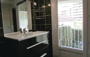 a bathroom with a sink and a window at 1 Bedroom Nice Apartment In Bastia in Bastia