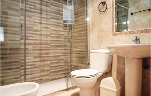 a bathroom with a toilet and a sink and a shower at Stunning Home In La Marina, Elche in La Marina +32 photos
