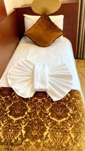 A bed or beds in a room at HOTEL EURO DIAMOND