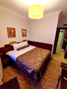 A bed or beds in a room at HOTEL EURO DIAMOND