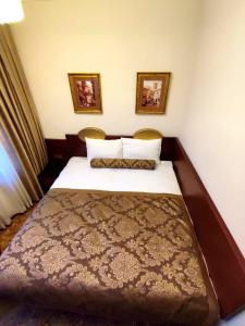 A bed or beds in a room at HOTEL EURO DIAMOND