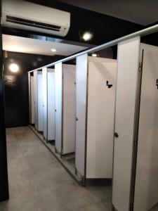 a row of white lockers in a room at Wink at Mosque Street in Singapore