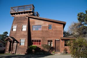 a house with a balcony on top of it at Sweetwater Inn and Spa in Mendocino