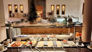 a buffet with many different types of food on display at ... mein romantisches Hotel Toalstock in Fiss