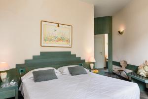 Voodi või voodid majutusasutuse Grand Hotel Panoramic toas