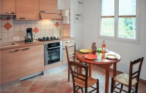 a kitchen with a table and chairs in a kitchen at 1 Bedroom Gorgeous Home In Thueyts in Thueyts