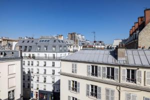 a view of a city with white buildings at Hotel Ernest in Paris