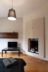 a bedroom with a bed and a fireplace at ClickTheFlat Legionowo Apart Rooms in Legionowo