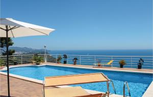 a swimming pool with a view of the ocean at Nice Home In Blanes With Wifi in Blanes