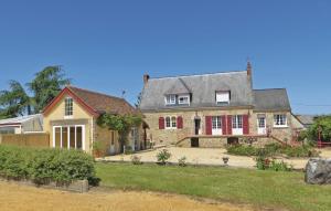 a large brick house with red shutters on it at Gorgeous Home In Juigne Sur Sarthe in Sablé-sur-Sarthe +19 photos