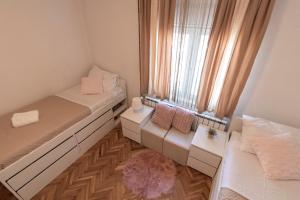 Postel nebo postele na pokoji v ubytování Melanie