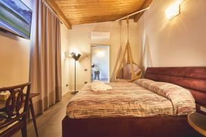 Postel nebo postele na pokoji v ubytování Le Stagioni Luxury Suite