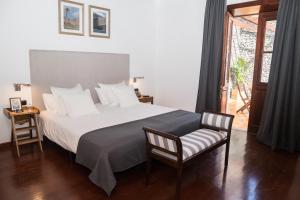 Łóżko lub łóżka w pokoju w obiekcie Hotel Escuela Rural Casa Los Herrera